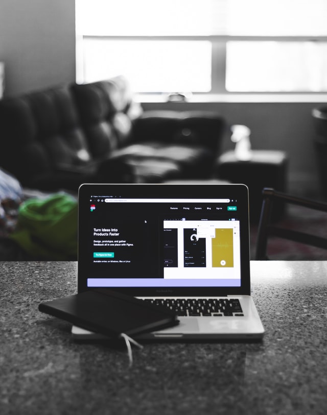 this image is showing an office table with laptop on and showing growth with affordable digital marketing service in small business in surat.